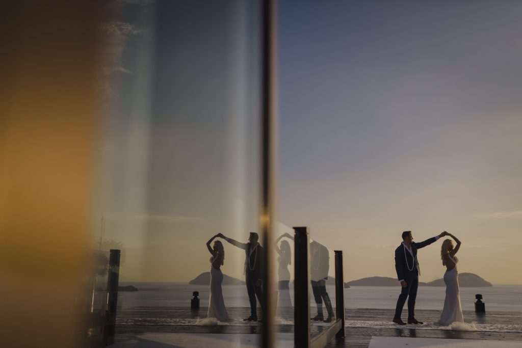 Wedding photographer in Cape Cod captures sunset portraits on rooftop