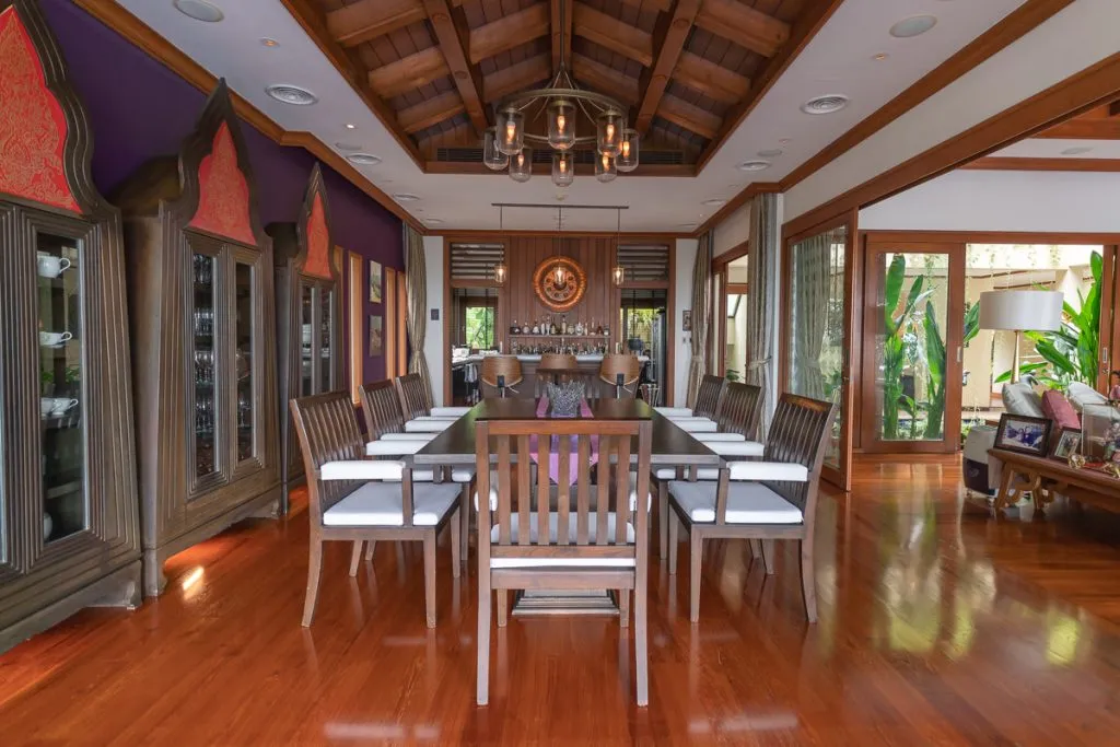 Elegant dining room with wooden decor, by Cape Cod real estate photographer Daniel Baci