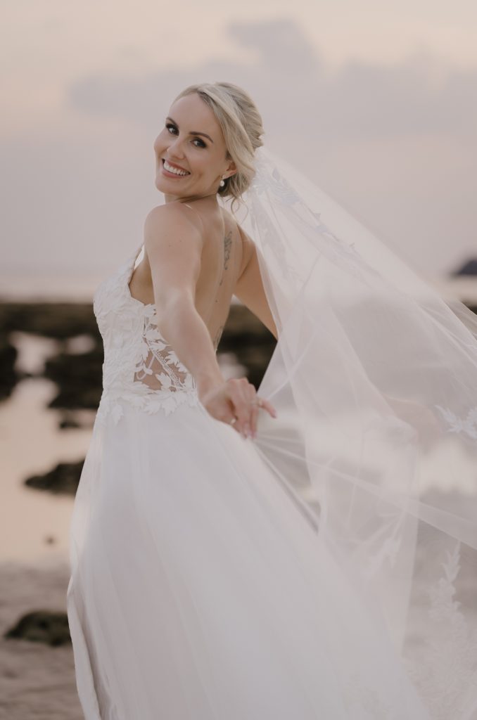 Brides beach portrait at sunset by Cape Cod Wedding Photographer.