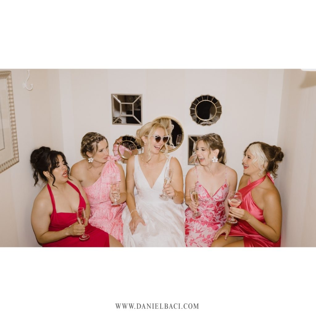 Having a Champaign toast in the bathtub with bridal party.