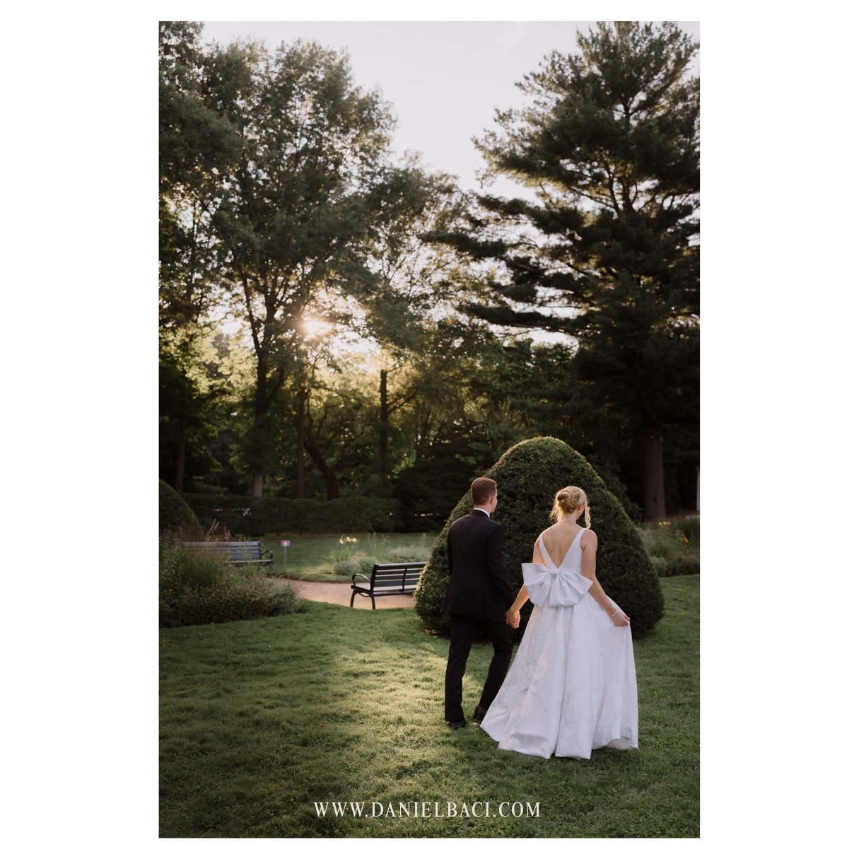 Bride and groom portrait walking to join their guests at luxury wedding in the North Shore.