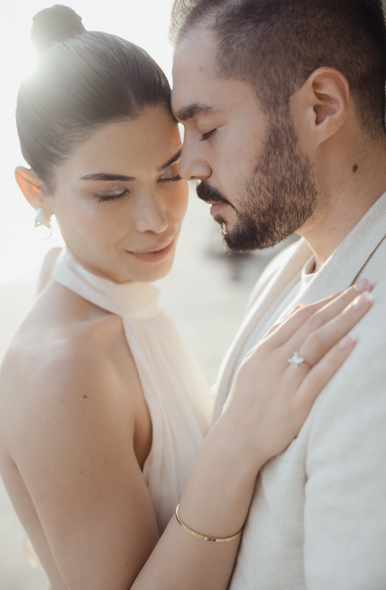 Cape Cod Wedding photographer portrait of bride and groom at Chatham Lighthouse Beach at sunset.