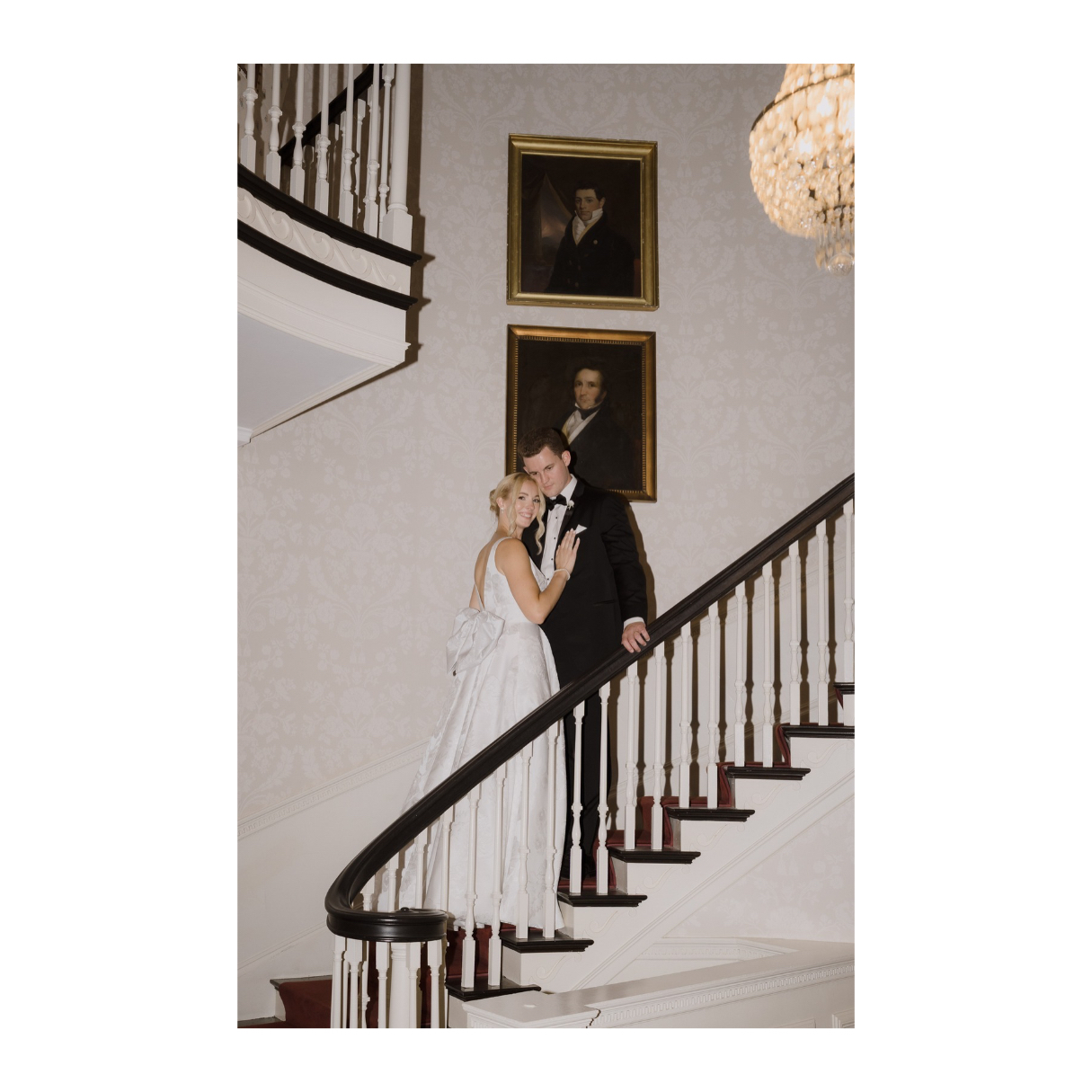 Portrait of bride and groom posing on the staircase at Glen Magna Farms in Danvers, MA.