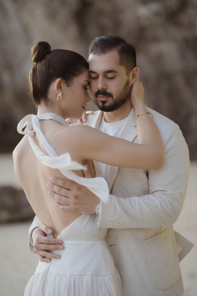 Bride and groom embrace for a Cape Cod wedding portrait