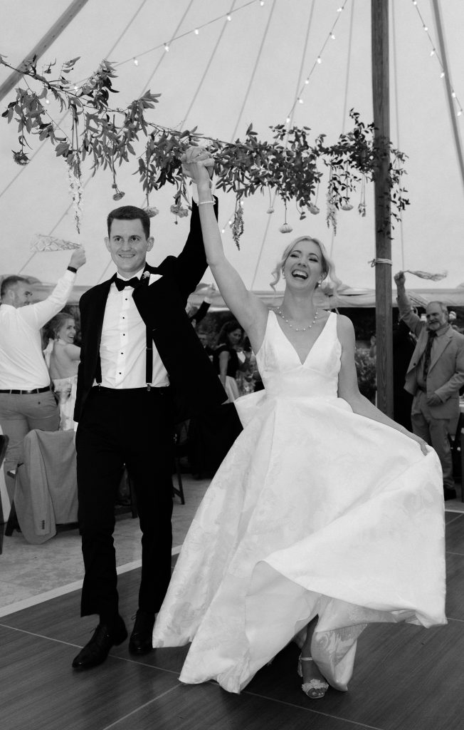 Bride and groom make their entrance into the reception