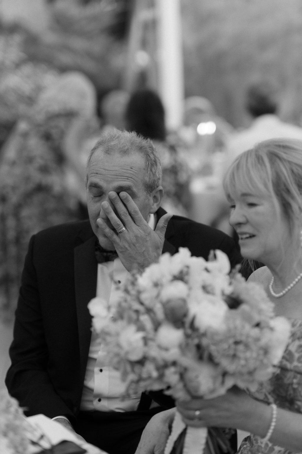 Parents moved to tears during a Cape Cod wedding ceremony, black and white photo