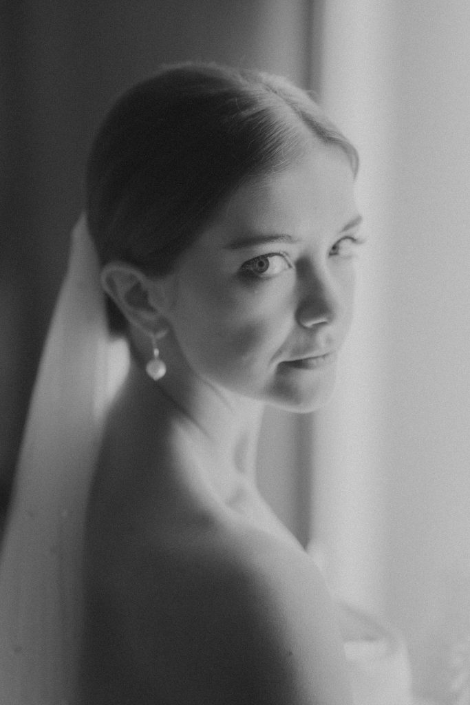 Black and white portrait of a bride in her veil