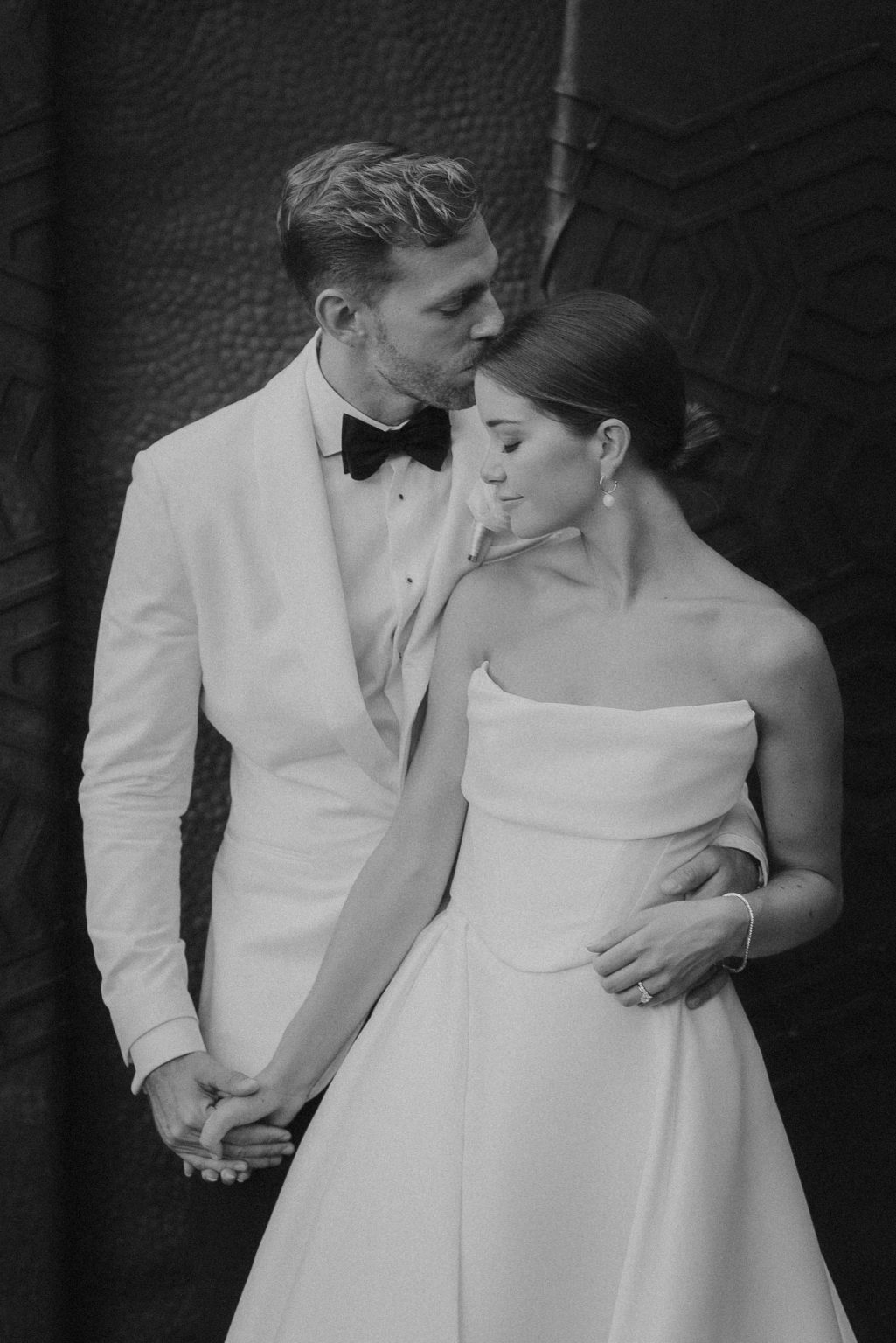 Black and white portrait of a couple embracing