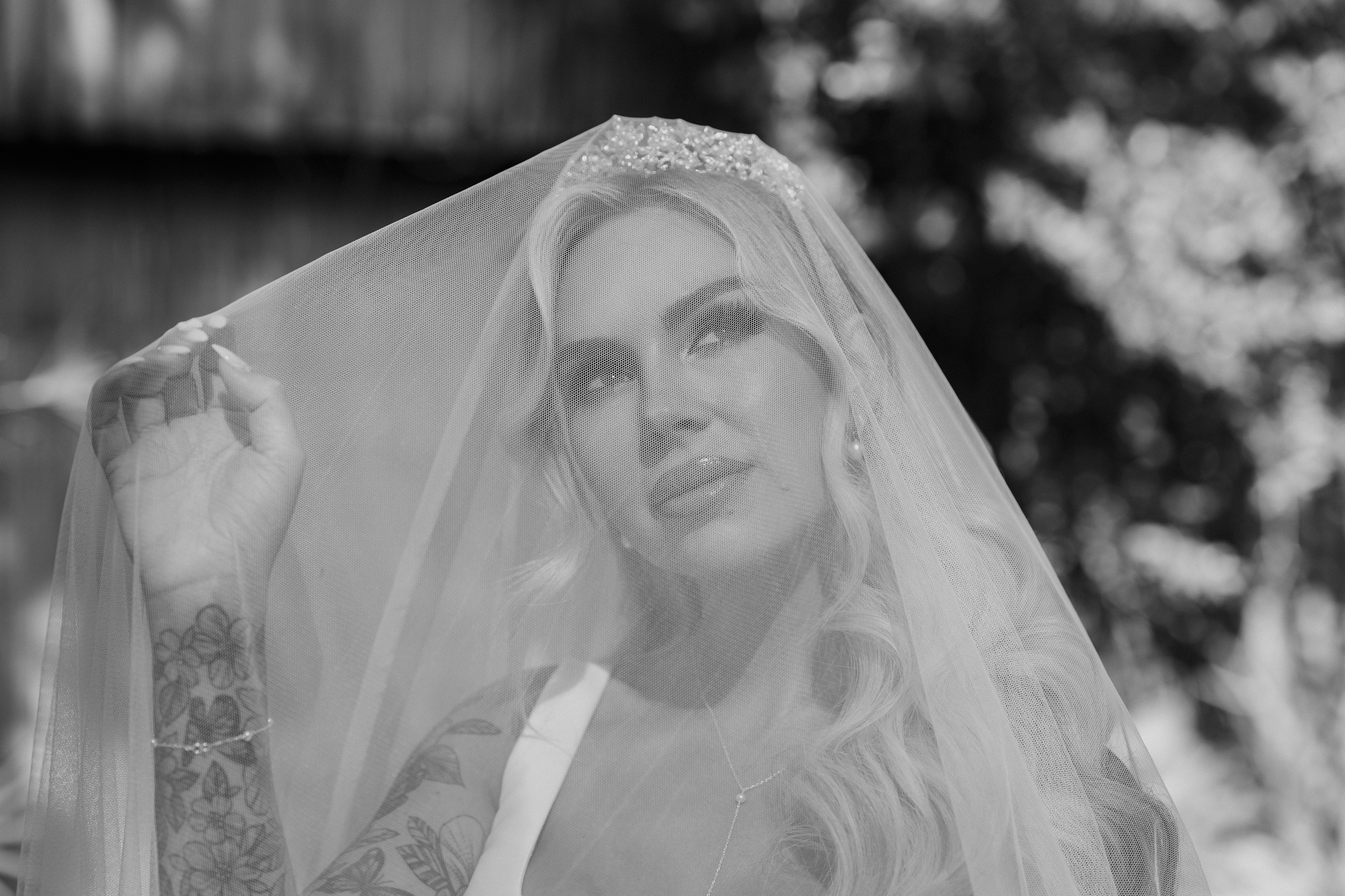 Black & white portrait of bride under her veil shot by Cape cod wedding photographer, Daniel Baci