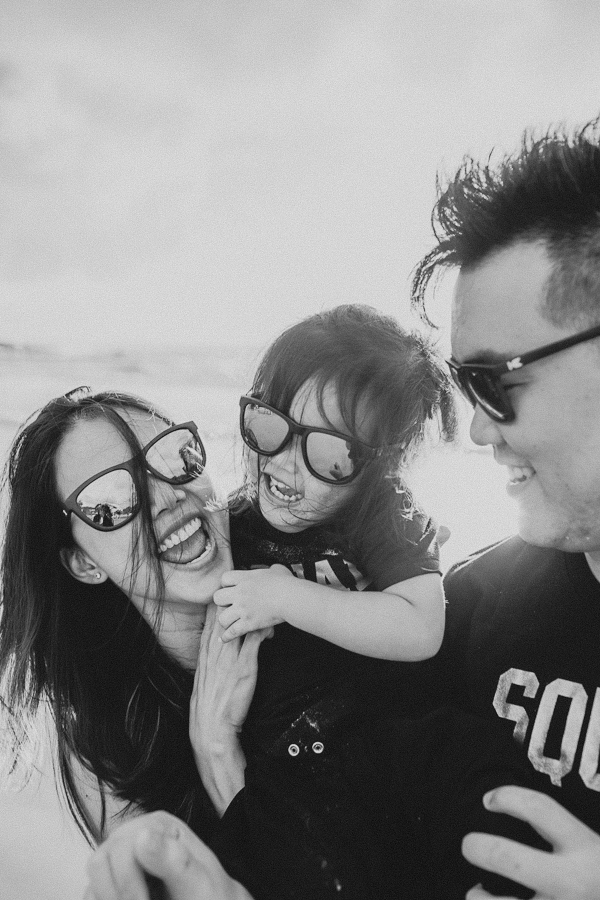 Black & white candid family photo captured by Cape Cod family photographer, Daniel Baci